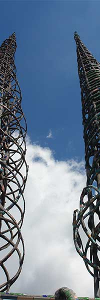 A series of photographs looking up at the vertical structures which Sam built.